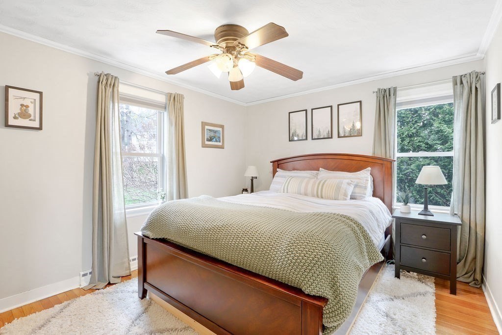 51 Forest Street Reading, MA 01867 - Photo 10 of 22 a bedroom with a large bed and a window