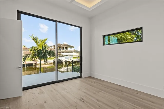 a view of front door with wooden floor