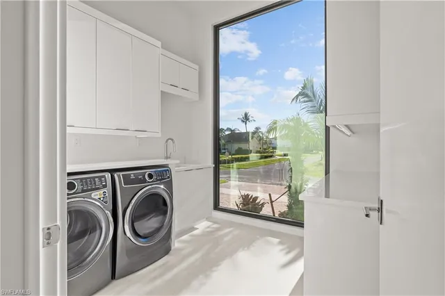 a view of a storage & utility room with washer and dryer