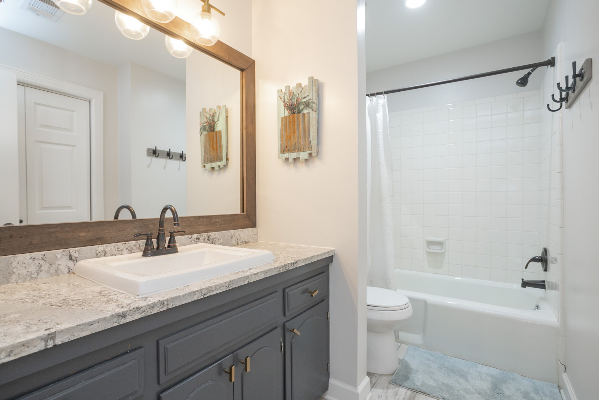 511 Arbor Drive Franklin, TN 37069 - Photo 18 of 24 a bathroom with a granite countertop sink a toilet and shower