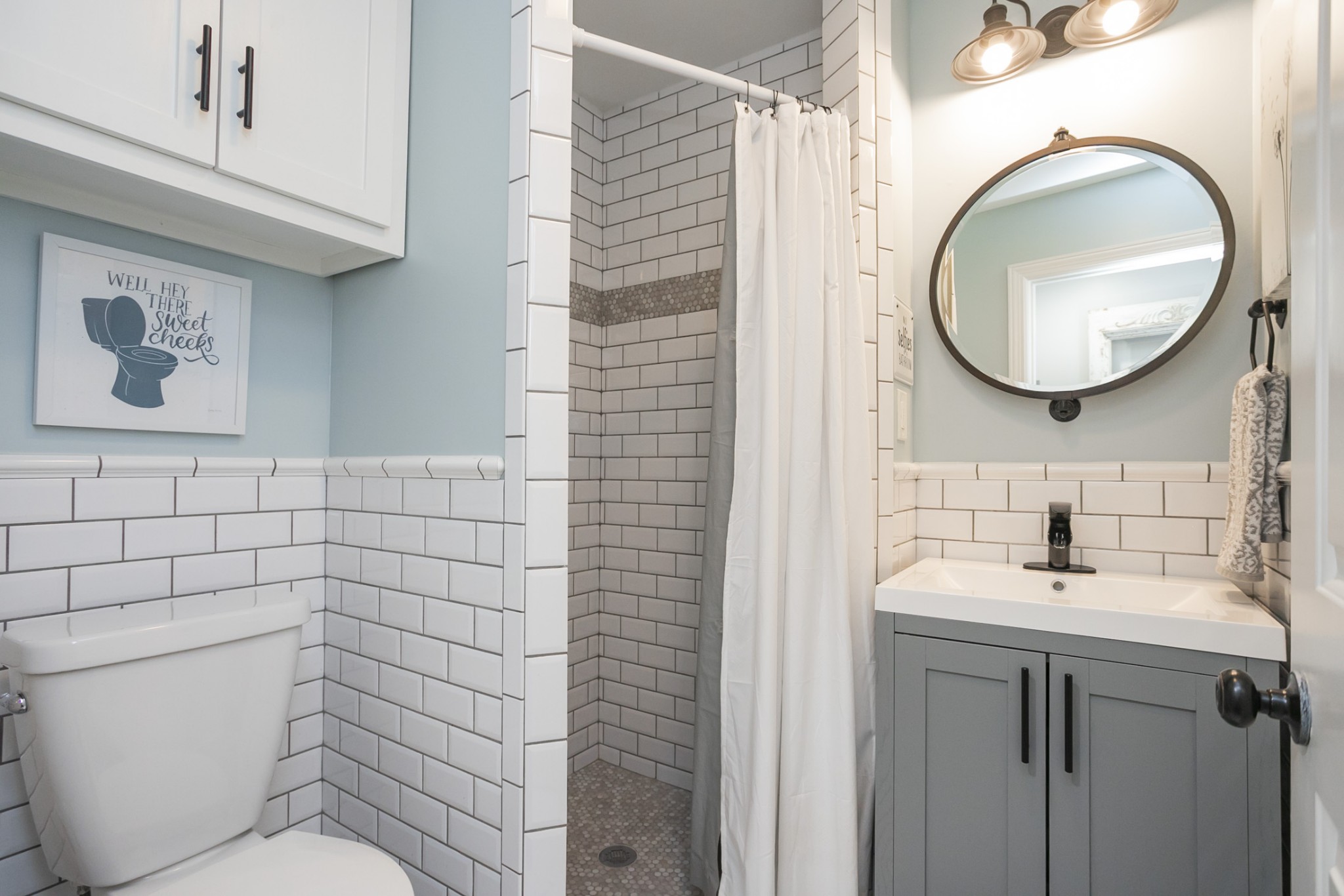 511 Arbor Drive Franklin, TN 37069 - Photo 20 of 24 a bathroom with a toilet sink and mirror