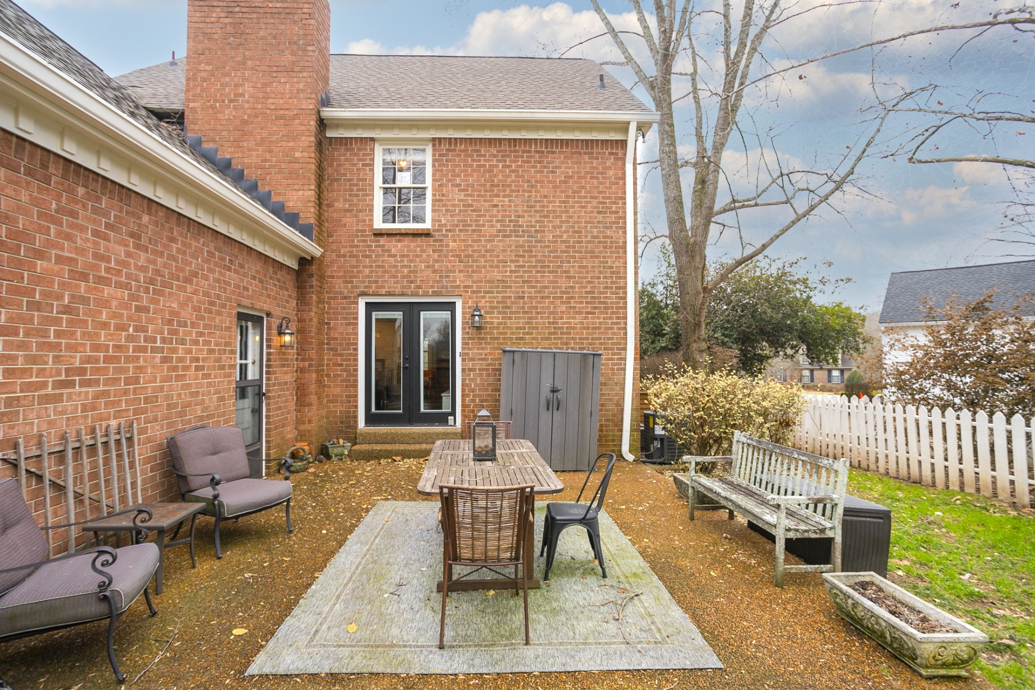 511 Arbor Drive Franklin, TN 37069 - Photo 21 of 24 a view of a patio with couches table and chairs and potted plants