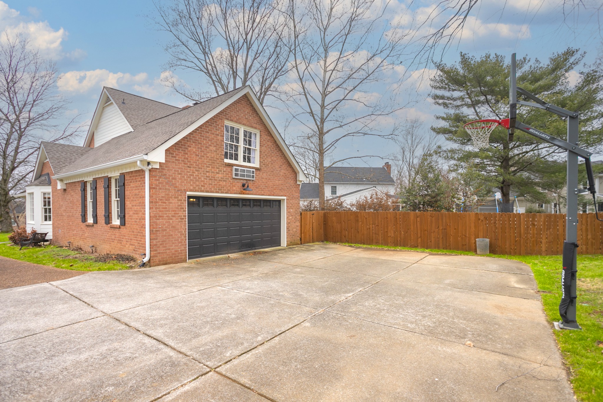 511 Arbor Drive Franklin, TN 37069 - Photo 4 of 24 a view of yellow house with a yard and potted plants