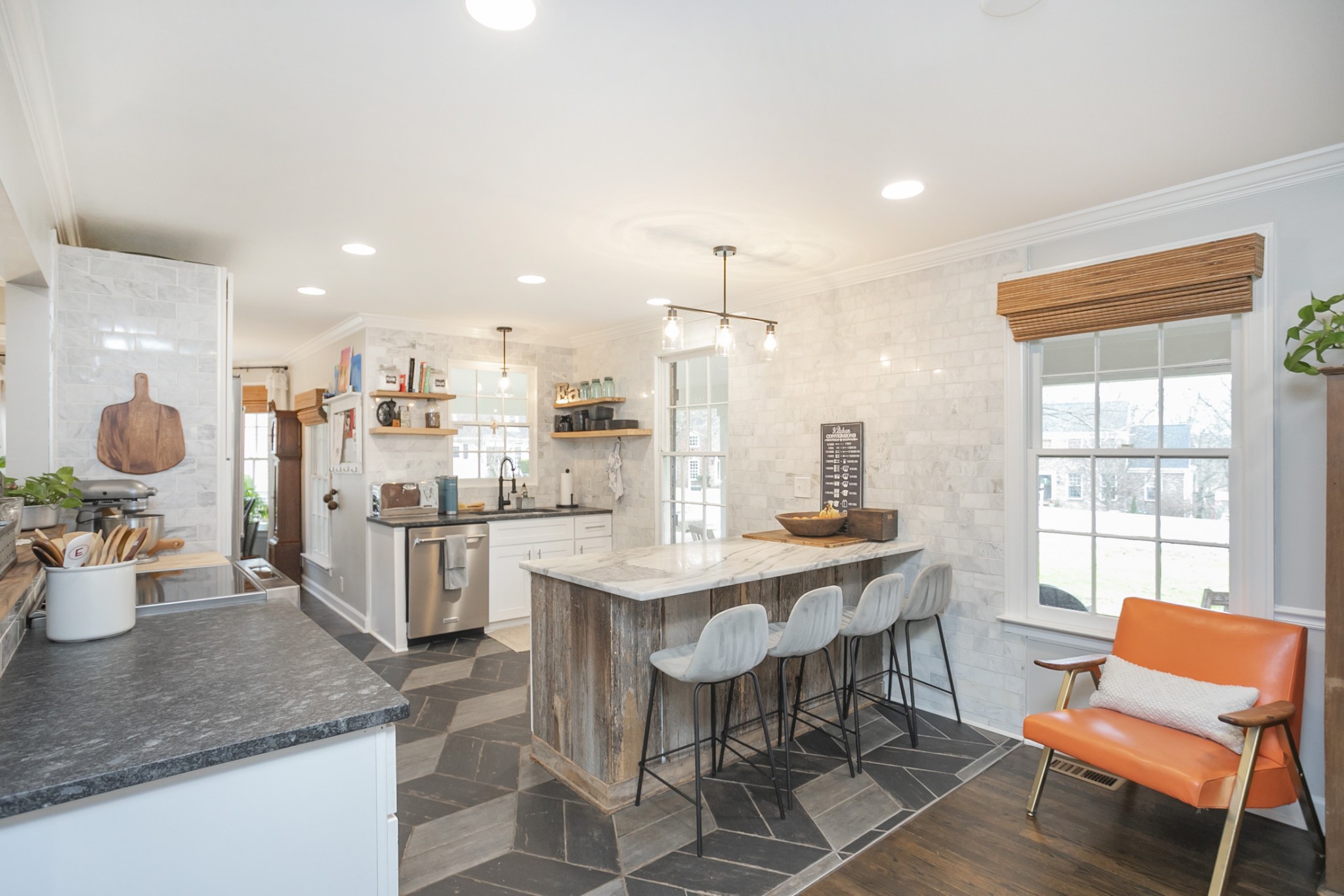 511 Arbor Drive Franklin, TN 37069 - Photo 6 of 24 a kitchen with a dining table chairs and white cabinets