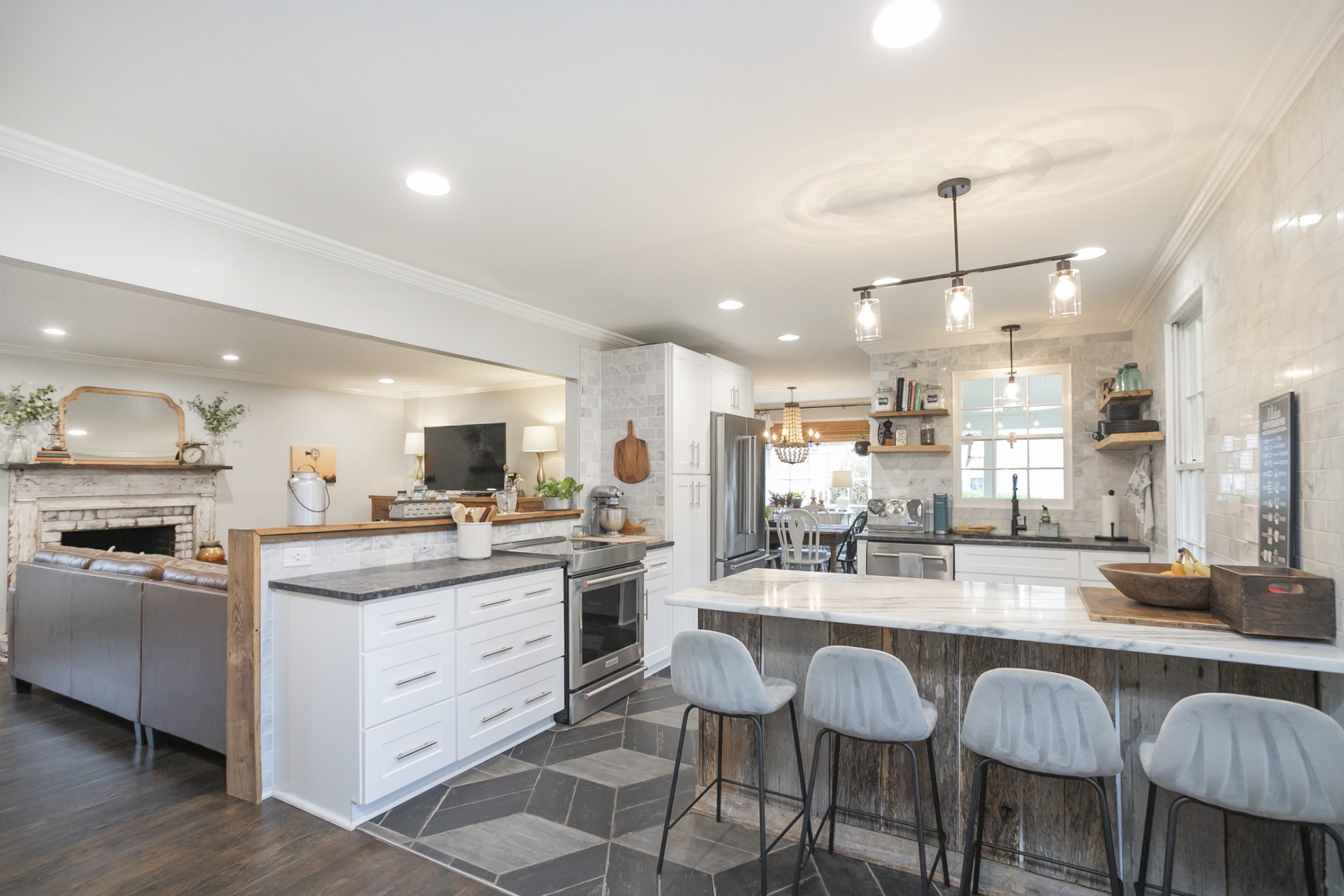 511 Arbor Drive Franklin, TN 37069 - Photo 7 of 24 a kitchen with kitchen island granite countertop a sink and stove