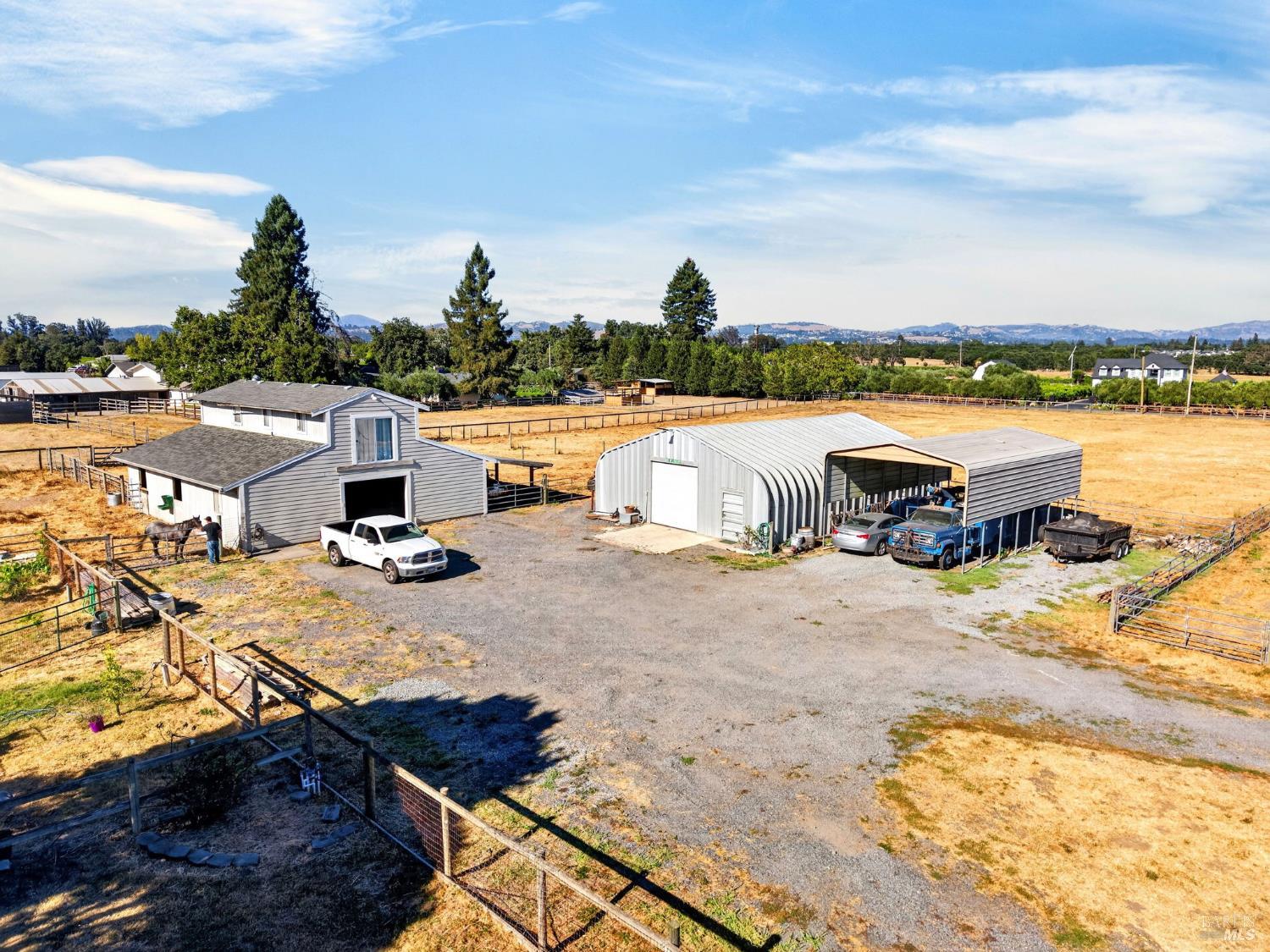 1623 Abramson Road Santa Rosa, CA 95401 - Photo 33 of 67 Barn with 5 stalls plus a tack room and studio above with pastures on both sides. Large shop and covered RV or toy parking. Circular driveway for easy trailer parking.