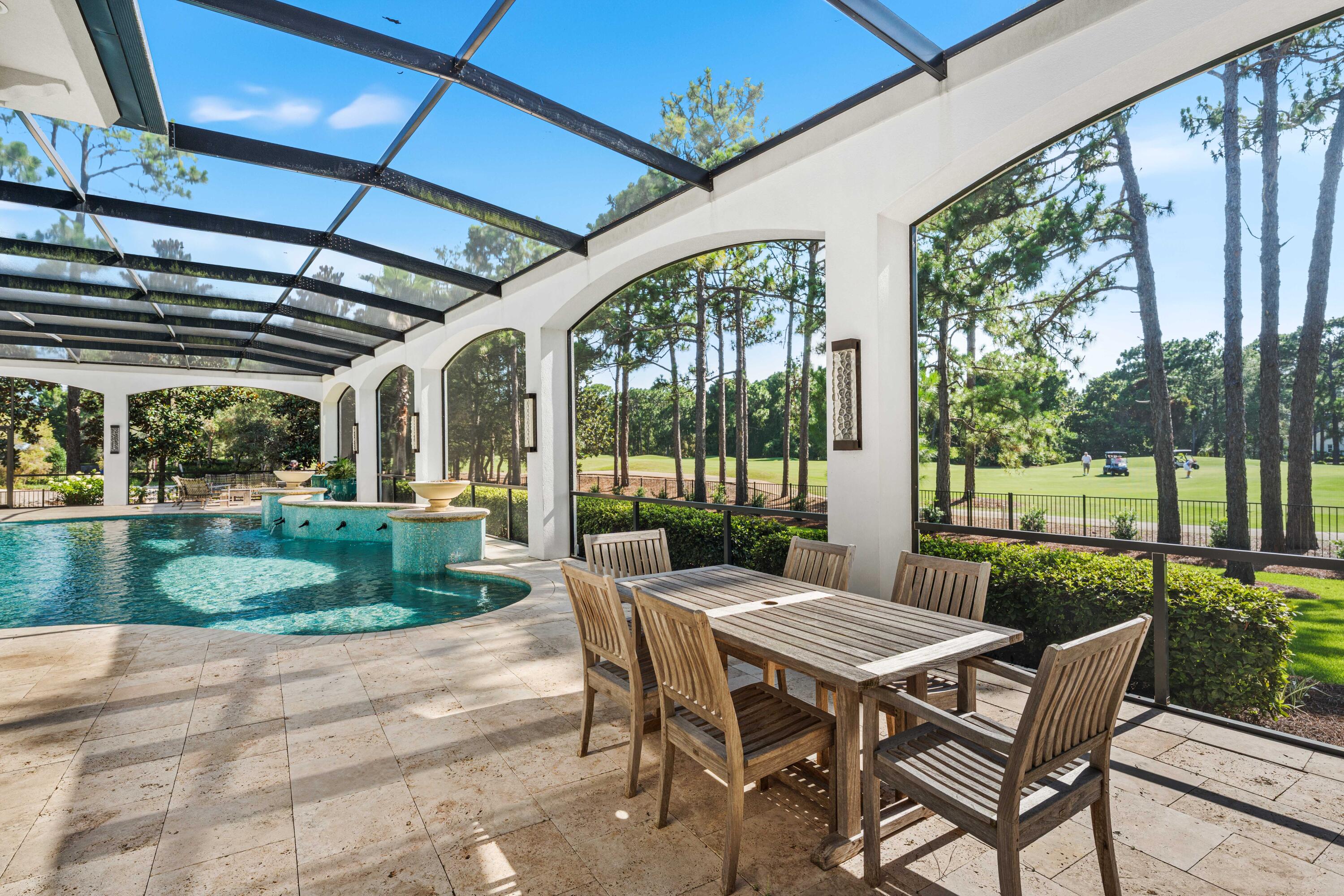 3570 Preserve Drive Miramar Beach, FL 32550 - Photo 35 of 86 a view of a patio with a table chairs and a backyard