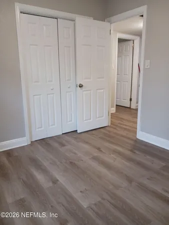 a view of a livingroom with wooden floor