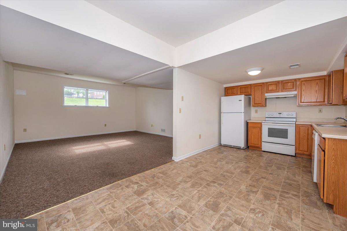 2723 Old Washington Road, Unit B Westminster, MD 21157 - Photo 12 of 37 a view of kitchen with stainless steel appliances a refrigerator and a stove top oven