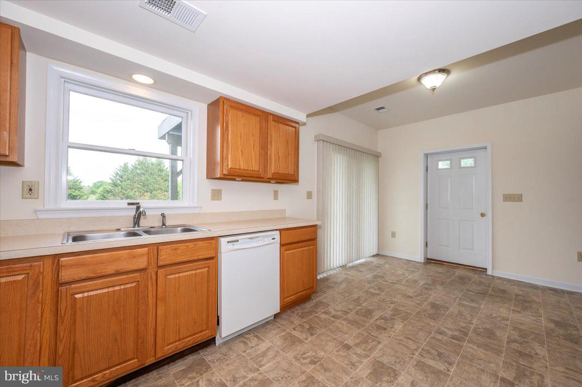 2723 Old Washington Road, Unit B Westminster, MD 21157 - Photo 16 of 37 a kitchen with a sink stove and cabinets