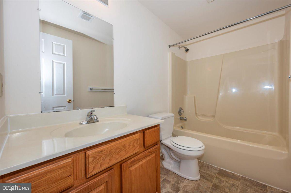 2723 Old Washington Road, Unit B Westminster, MD 21157 - Photo 24 of 37 a bathroom with a sink a toilet and shower