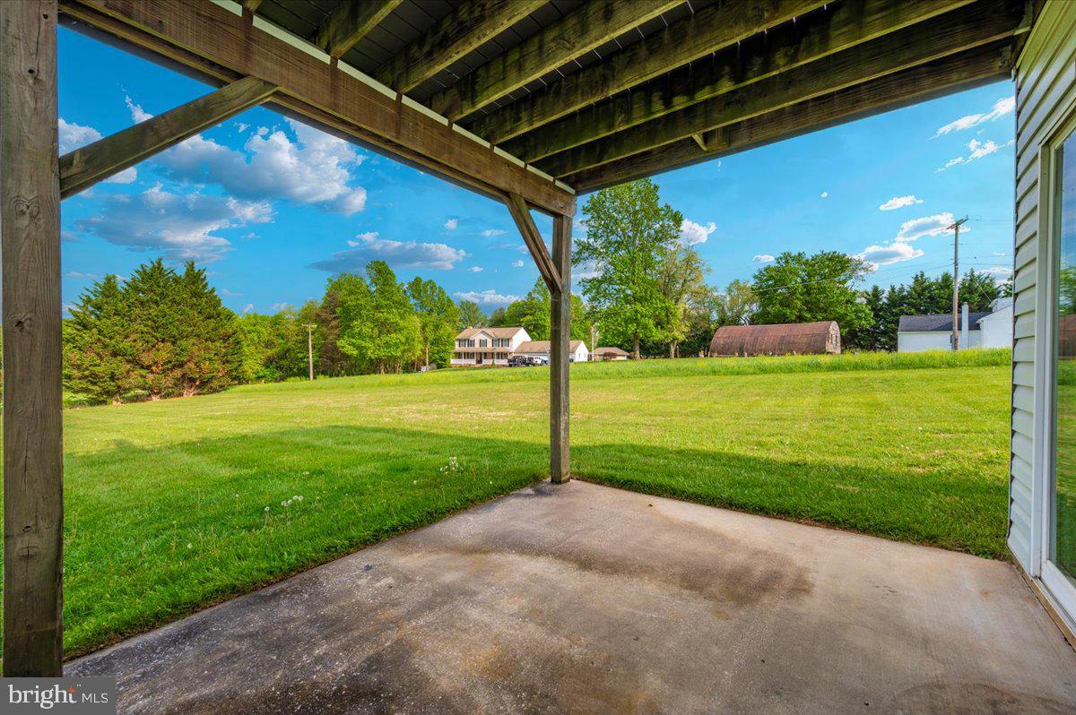 2723 Old Washington Road, Unit B Westminster, MD 21157 - Photo 29 of 37 a view of a backyard with table and chairs