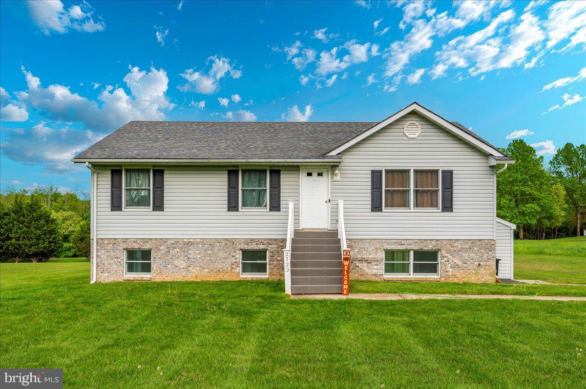 2723 Old Washington Road, Unit B Westminster, MD 21157 - Photo 35 of 37 a front view of a house with a garden