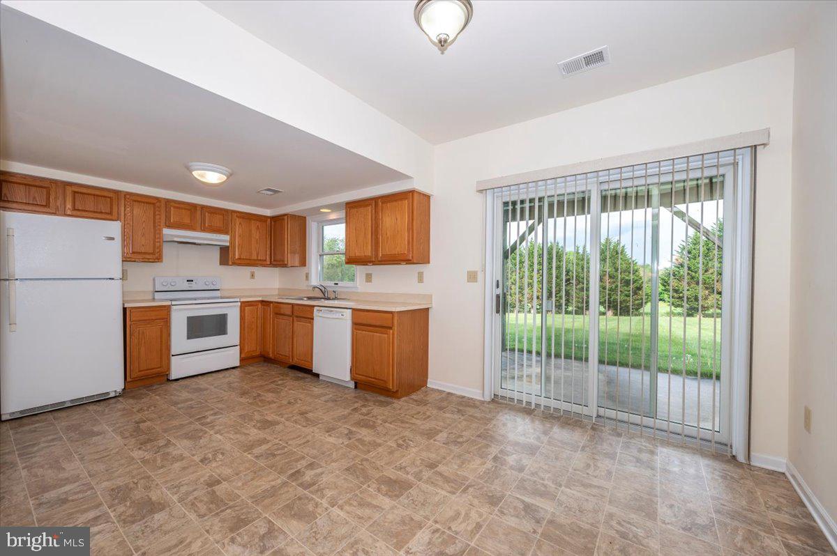 2723 Old Washington Road, Unit B Westminster, MD 21157 - Photo 8 of 37 a kitchen with a refrigerator sink and cabinets
