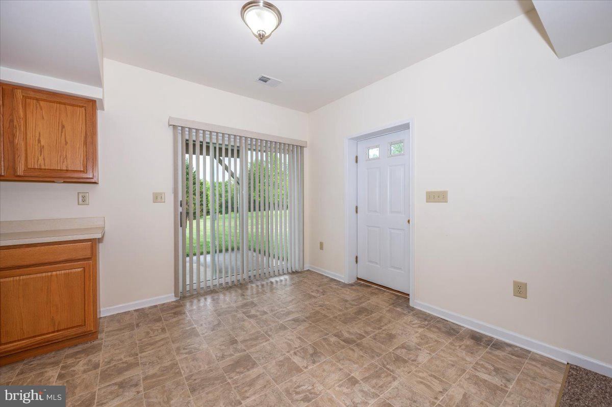 2723 Old Washington Road, Unit B Westminster, MD 21157 - Photo 10 of 37 a view of an empty room with glass door