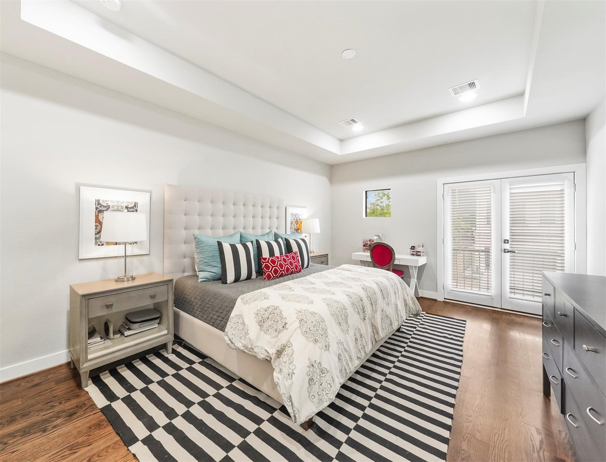 1309 Laird Street, Unit A Houston, TX 77008 - Photo 11 of 22 a bedroom with three beds and a large window