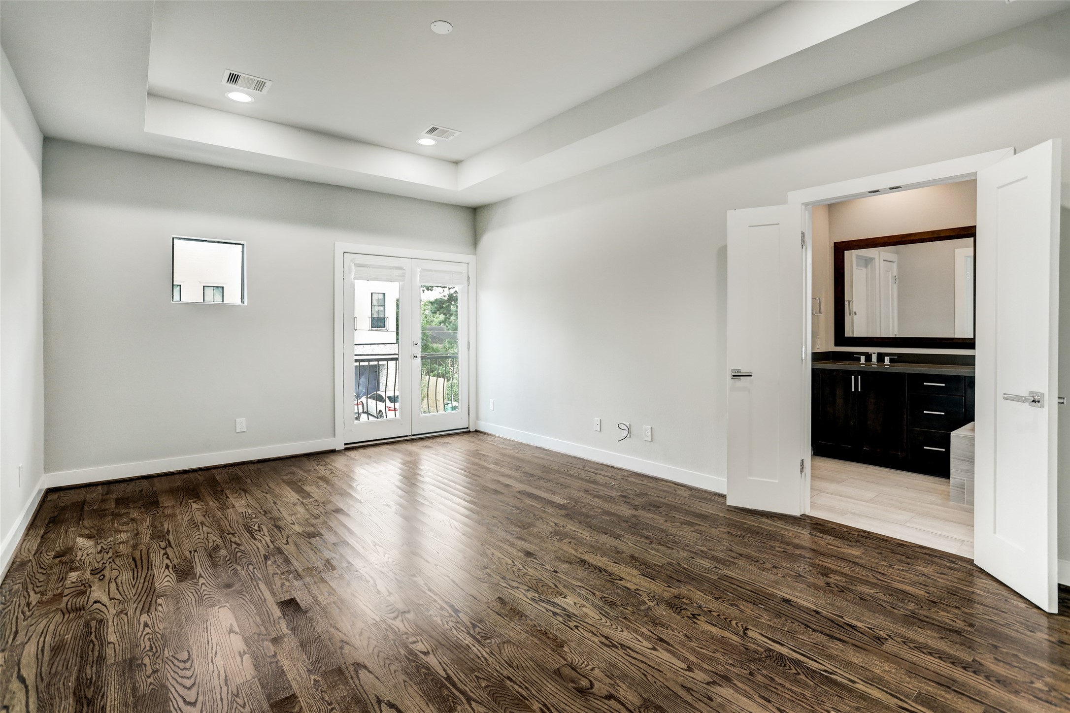 1309 Laird Street, Unit A Houston, TX 77008 - Photo 12 of 22 a view of an empty room with window and wooden floor
