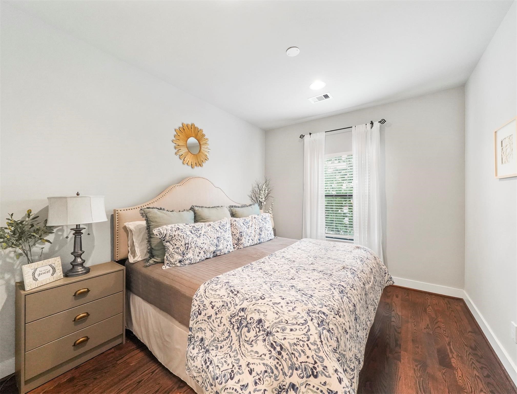 1309 Laird Street, Unit A Houston, TX 77008 - Photo 16 of 22 a bedroom with a bed and a window