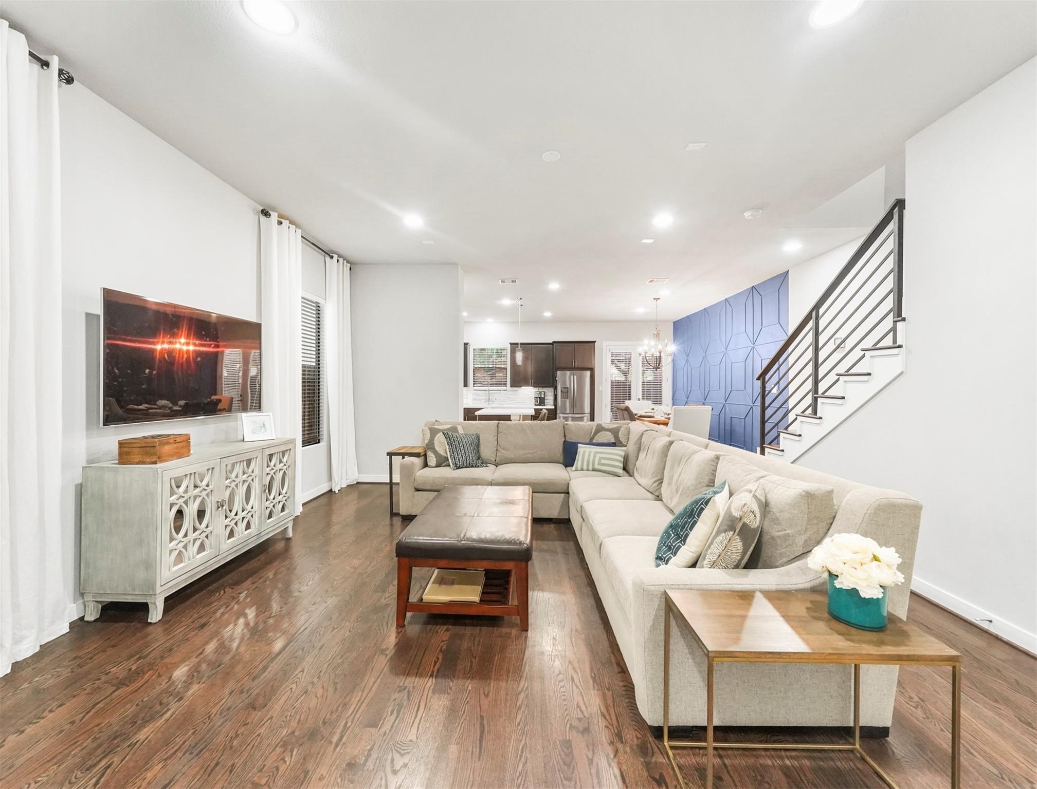 1309 Laird Street, Unit A Houston, TX 77008 - Photo 2 of 22 a living room with furniture and a flat screen tv