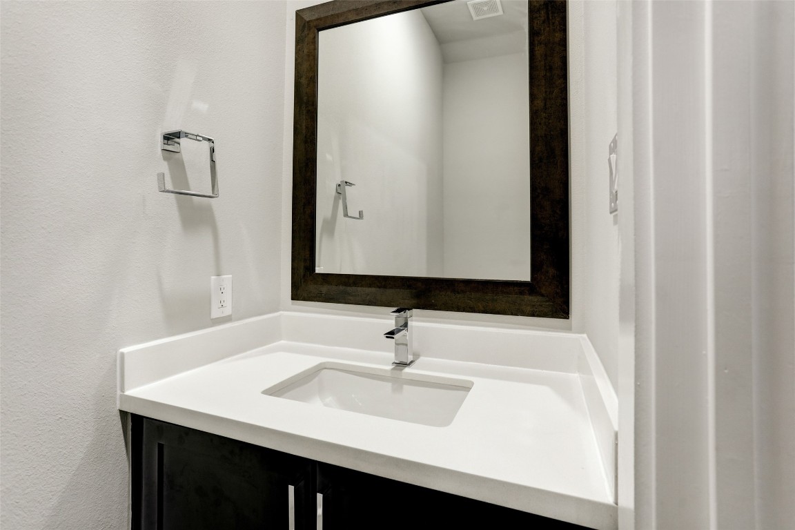 1309 Laird Street, Unit A Houston, TX 77008 - Photo 4 of 22 a bathroom with a sink and a mirror