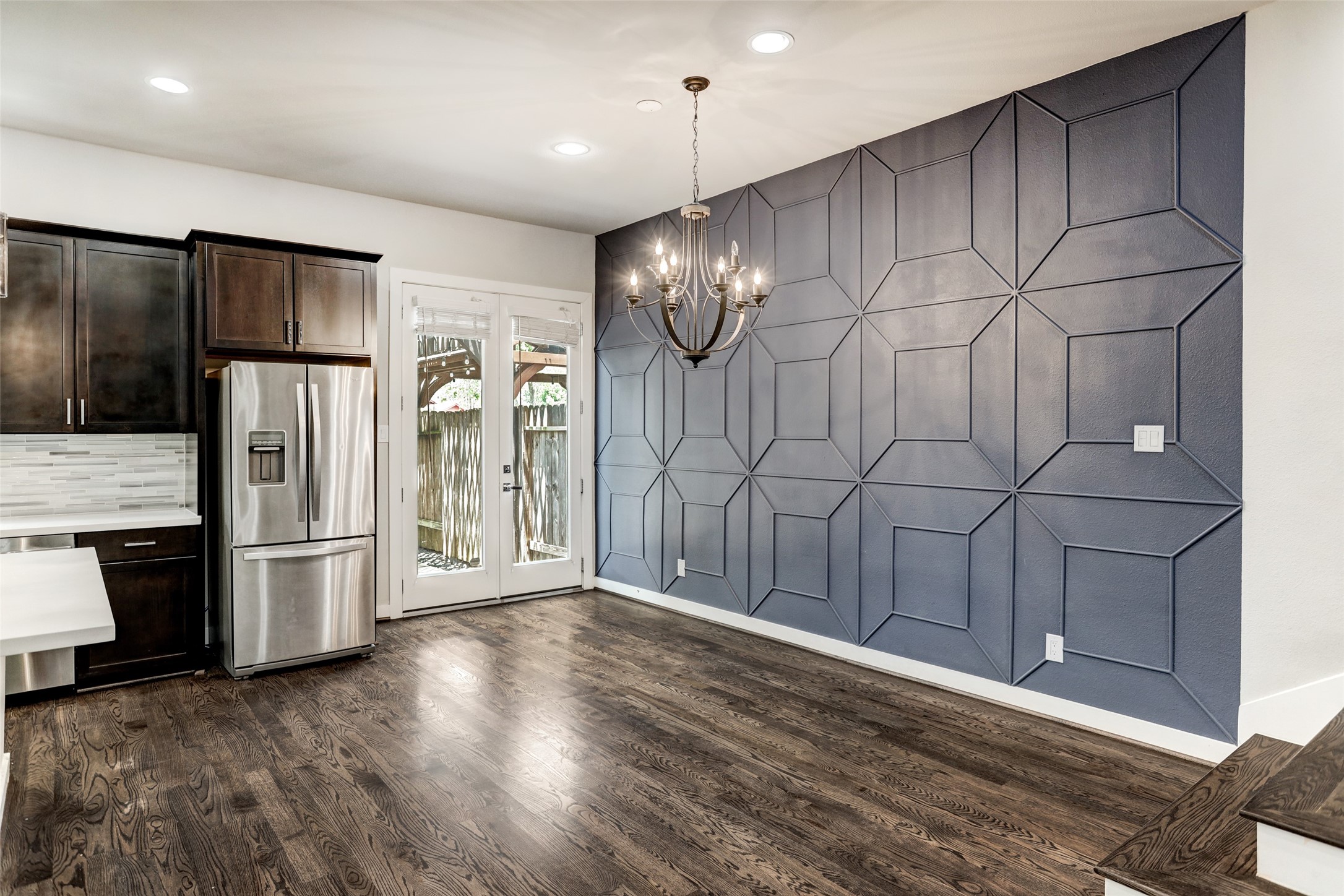 1309 Laird Street, Unit A Houston, TX 77008 - Photo 9 of 22 a view of a kitchen with a sink and stainless steel appliances wooden floor