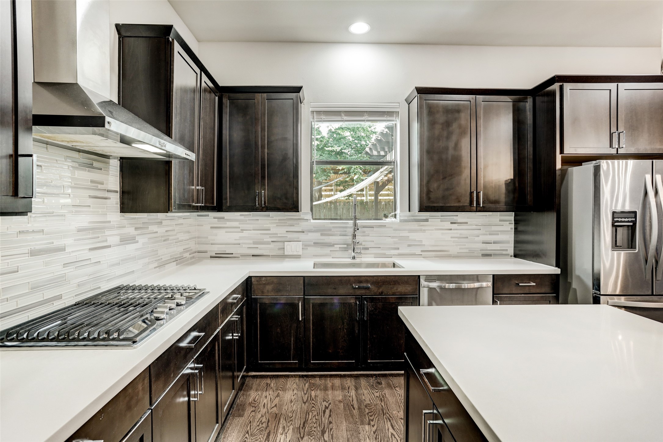 1309 Laird Street, Unit A Houston, TX 77008 - Photo 10 of 22 a kitchen with a sink stove and refrigerator