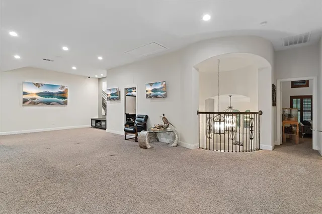 an empty room with furniture and entryway