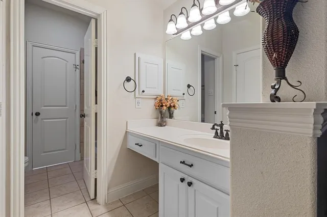 a bathroom with a sink a mirror and a shower