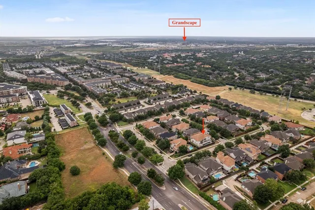 an aerial view of residential houses with city view