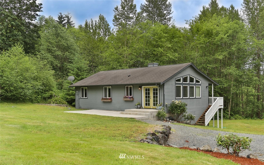 15519 OK Mill Road Snohomish, WA 98290 - Photo 1 of 32 a front view of a house with a yard