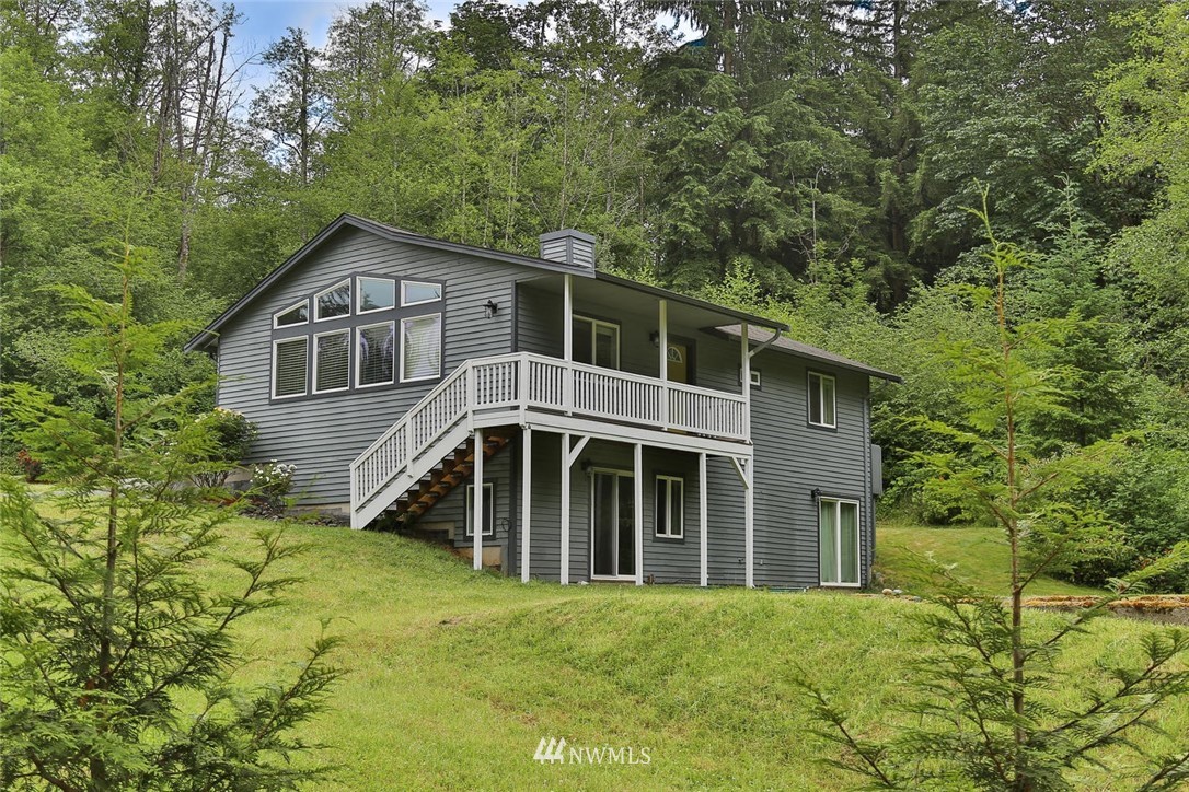 15519 OK Mill Road Snohomish, WA 98290 - Photo 2 of 32 a view of a house with a yard and large trees