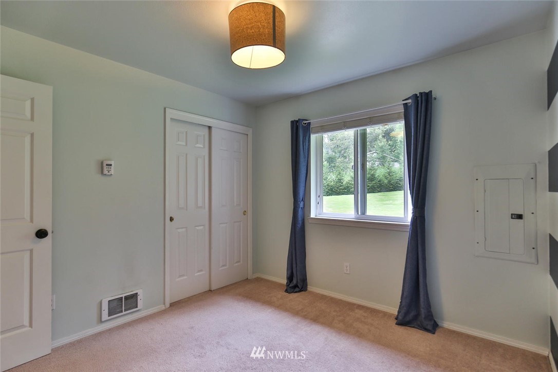 15519 OK Mill Road Snohomish, WA 98290 - Photo 14 of 32 a view of an empty room with window and closet area