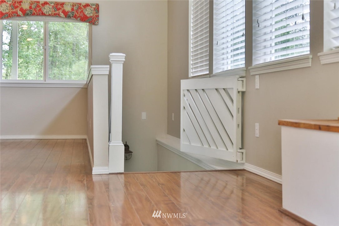 15519 OK Mill Road Snohomish, WA 98290 - Photo 16 of 32 a view of an empty room with wooden floor and a window