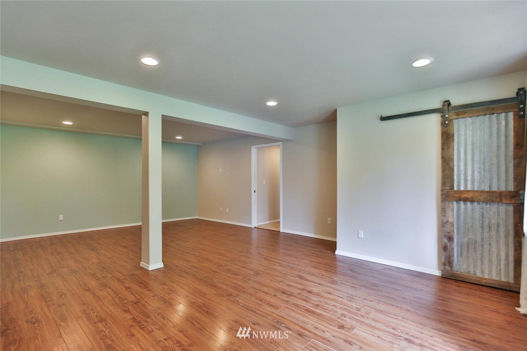 15519 OK Mill Road Snohomish, WA 98290 - Photo 17 of 32 a view of an empty room with wooden floor