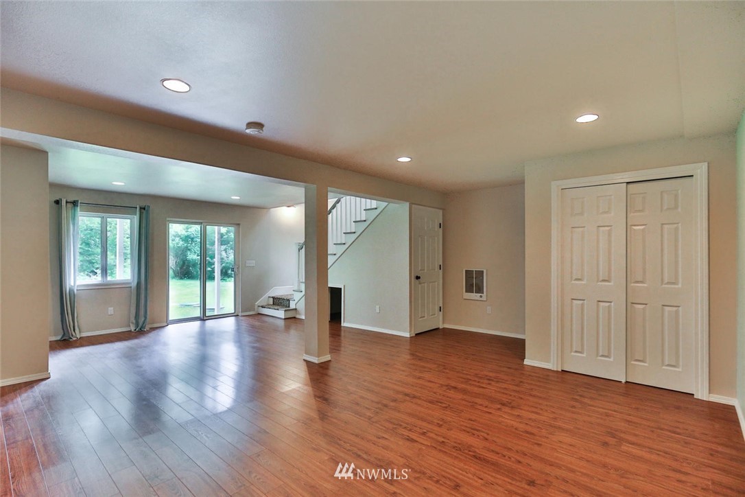 15519 OK Mill Road Snohomish, WA 98290 - Photo 18 of 32 a view of an empty room with wooden floor and a window
