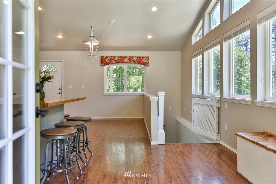 15519 OK Mill Road Snohomish, WA 98290 - Photo 3 of 32 a view of kitchen with furniture and wooden floor