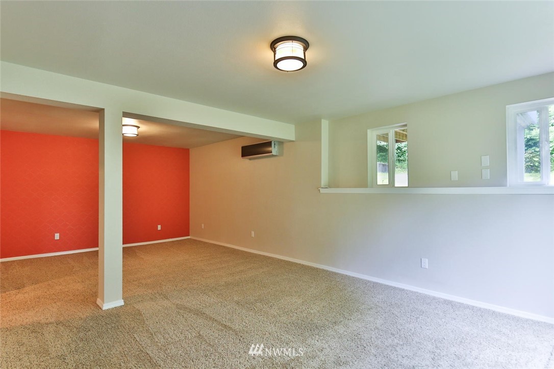 15519 OK Mill Road Snohomish, WA 98290 - Photo 21 of 32 an empty room with windows and closet