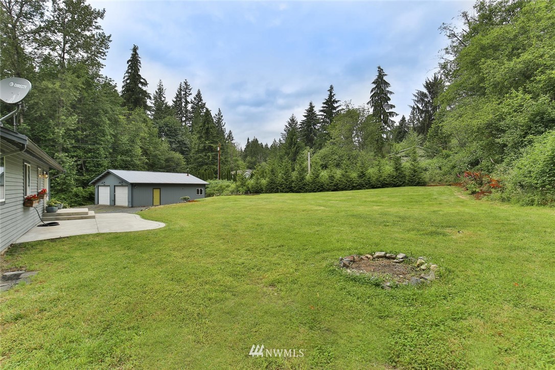 15519 OK Mill Road Snohomish, WA 98290 - Photo 25 of 32 a view of a house with a yard