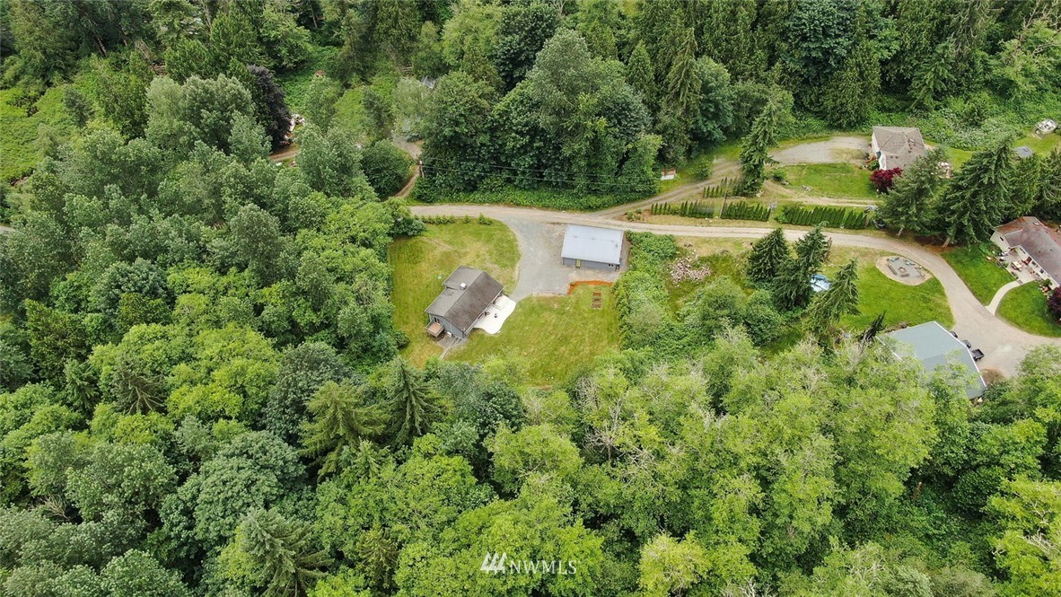 15519 OK Mill Road Snohomish, WA 98290 - Photo 30 of 32 an aerial view of residential house with outdoor space and trees all around
