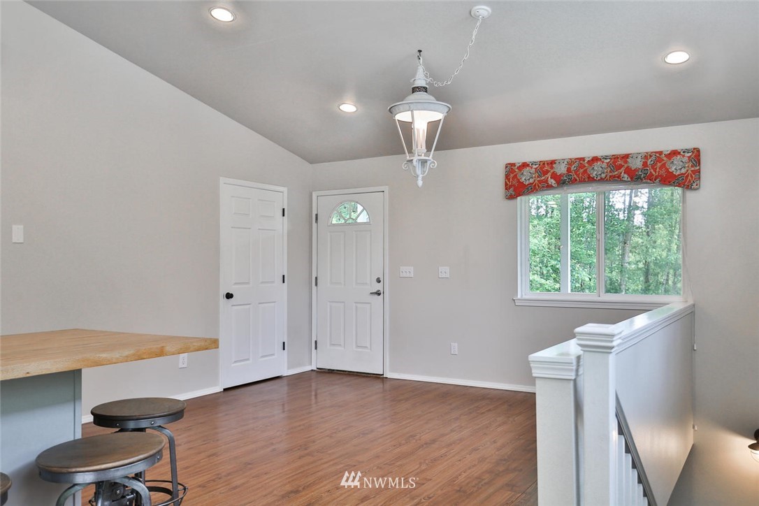 15519 OK Mill Road Snohomish, WA 98290 - Photo 10 of 32 a view of an empty room with a window and wooden floor