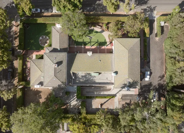 an aerial view of a house with outdoor space