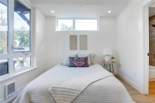 a bedroom with a bed and window