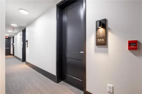 a kitchen with stainless steel appliances a sink a stove and a refrigerator