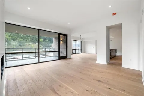 a view of an empty room with a closet