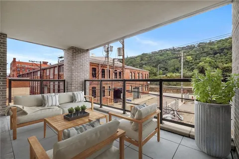 a view of a glass door with a hallway