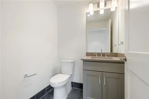 a bedroom with a bed and a mirror