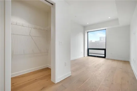 a bathroom with a double vanity sink toilet and shower