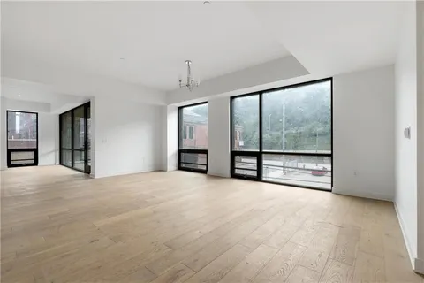 an empty room with large window