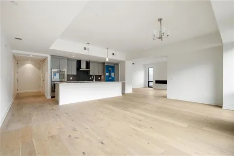 a view of hallway with bathroom and a bathroom