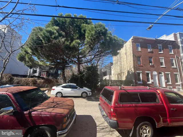 a front view of a house with parking space